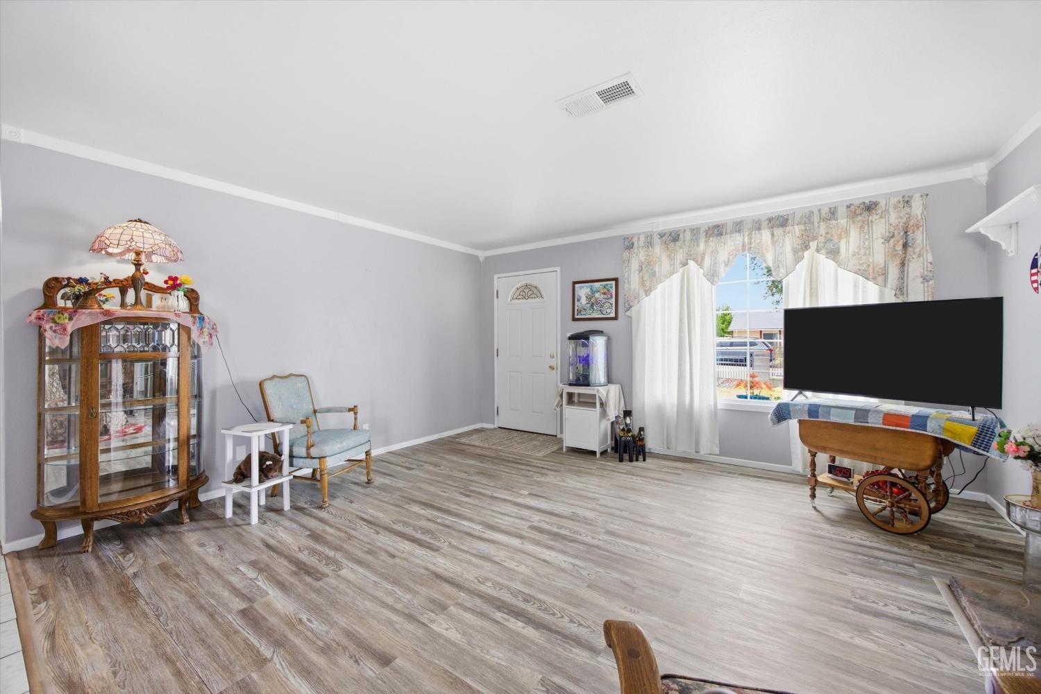 Undisclosed Address Tehachapi, CA 93561 - Photo 24 of 48 a view of a livingroom with workspace and a flat screen tv