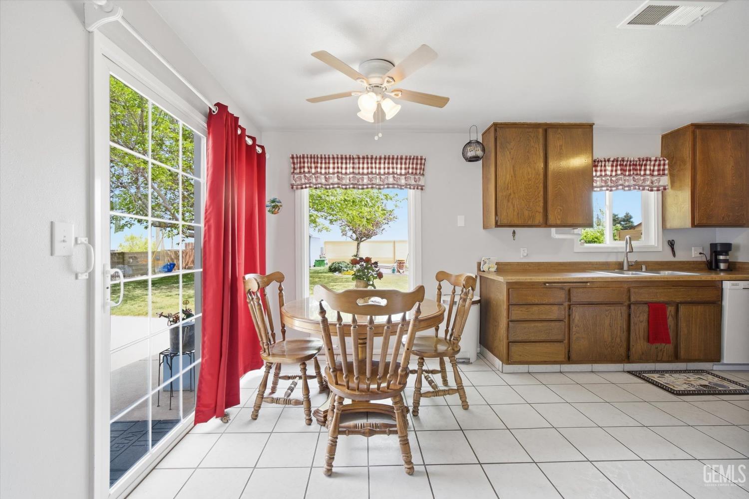 Undisclosed Address Tehachapi, CA 93561 - Photo 25 of 48 a kitchen with a table chairs and a stove