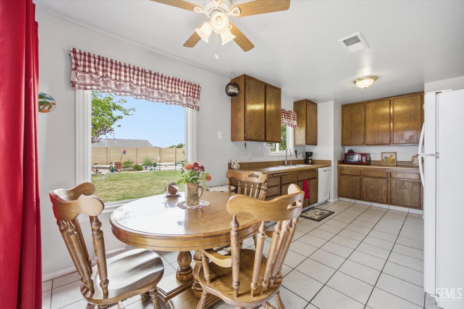 Undisclosed Address Tehachapi, CA 93561 - Photo 26 of 48 a view of a dining room with furniture a kitchen and chandelier