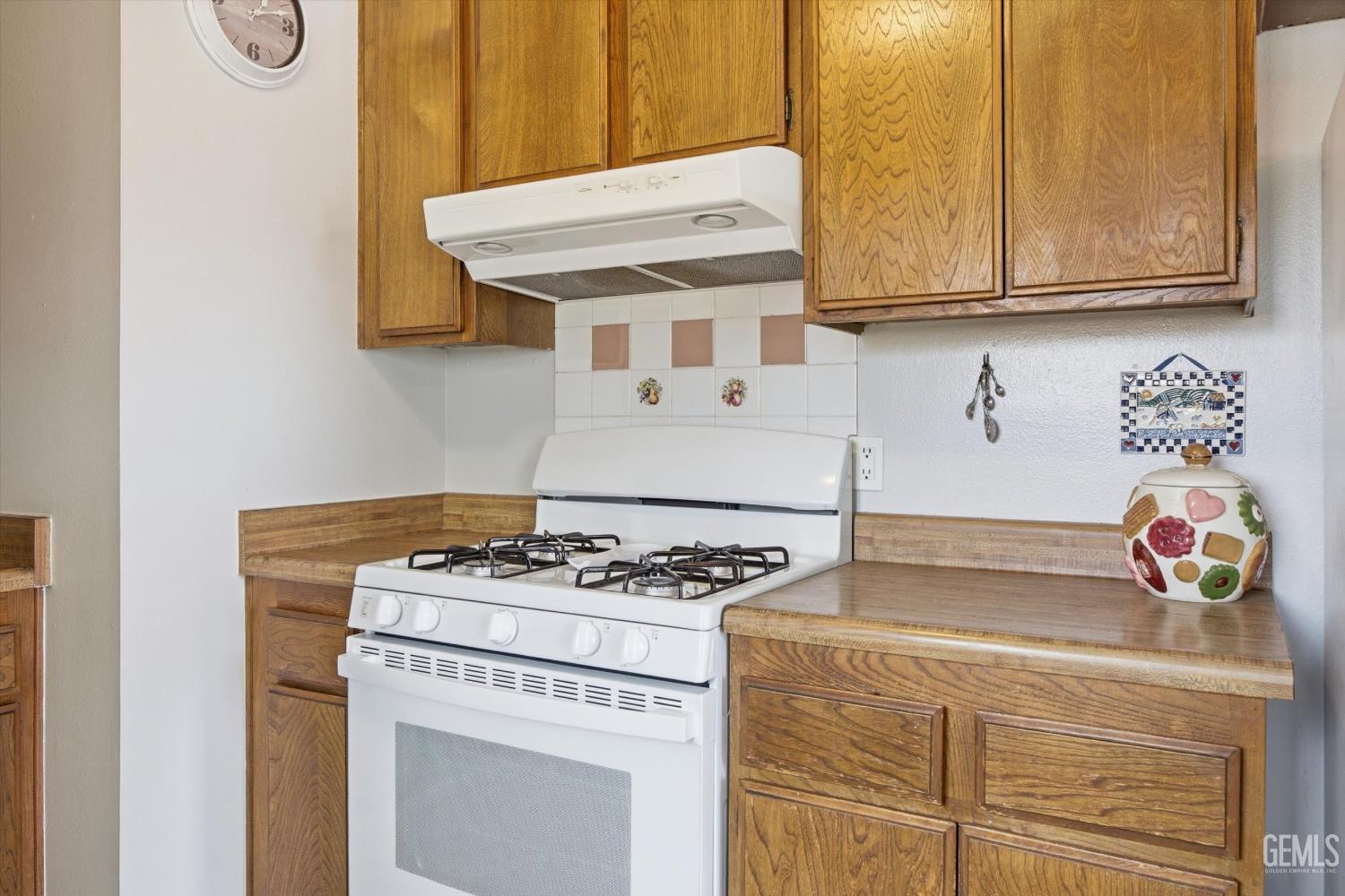 Undisclosed Address Tehachapi, CA 93561 - Photo 30 of 48 a kitchen with stainless steel appliances granite countertop a stove a sink and a microwave