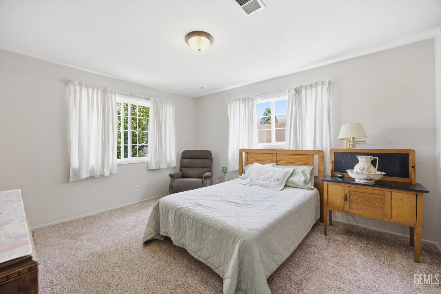 Undisclosed Address Tehachapi, CA 93561 - Photo 33 of 48 a bedroom with a bed and a window