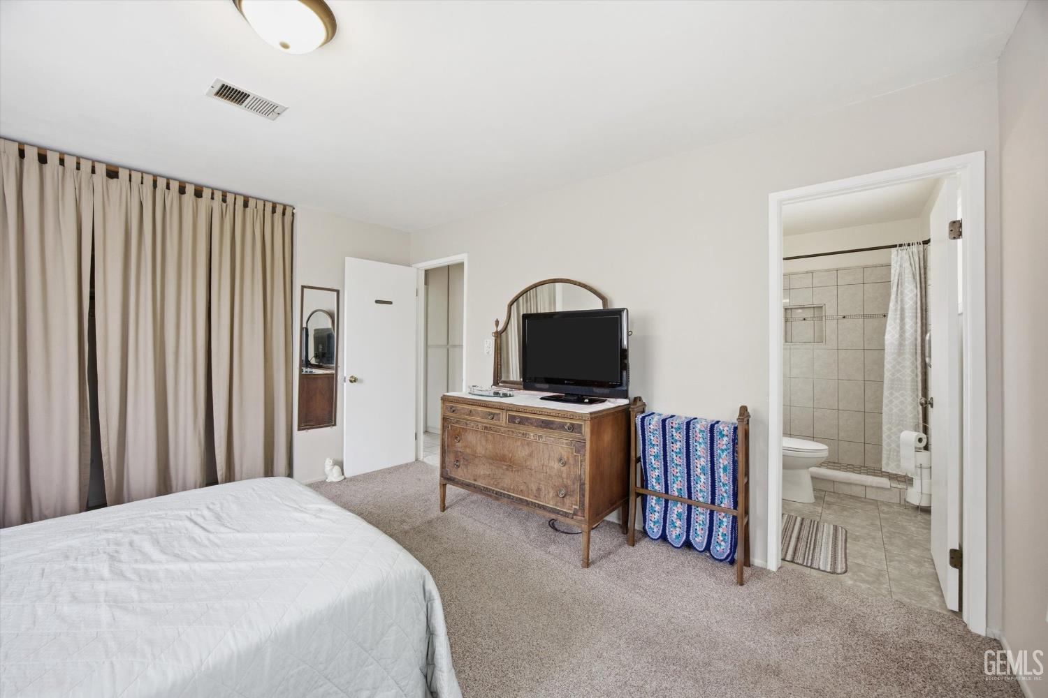 Undisclosed Address Tehachapi, CA 93561 - Photo 34 of 48 a bedroom with furniture and a flat screen tv