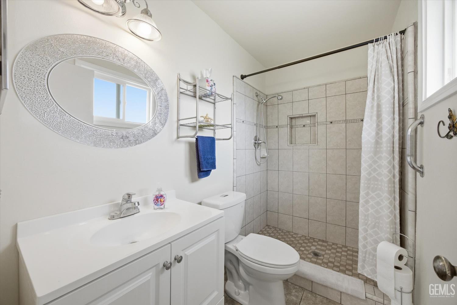 Undisclosed Address Tehachapi, CA 93561 - Photo 35 of 48 a bathroom with a sink a toilet and shower