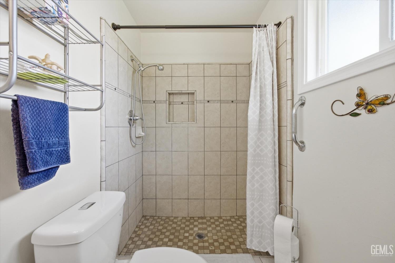 Undisclosed Address Tehachapi, CA 93561 - Photo 36 of 48 a bathroom with a shower and toilet