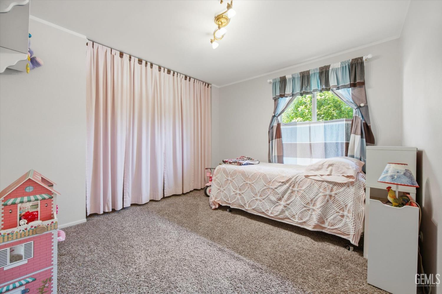 Undisclosed Address Tehachapi, CA 93561 - Photo 38 of 48 a bed sitting in a spacious bedroom next to a window