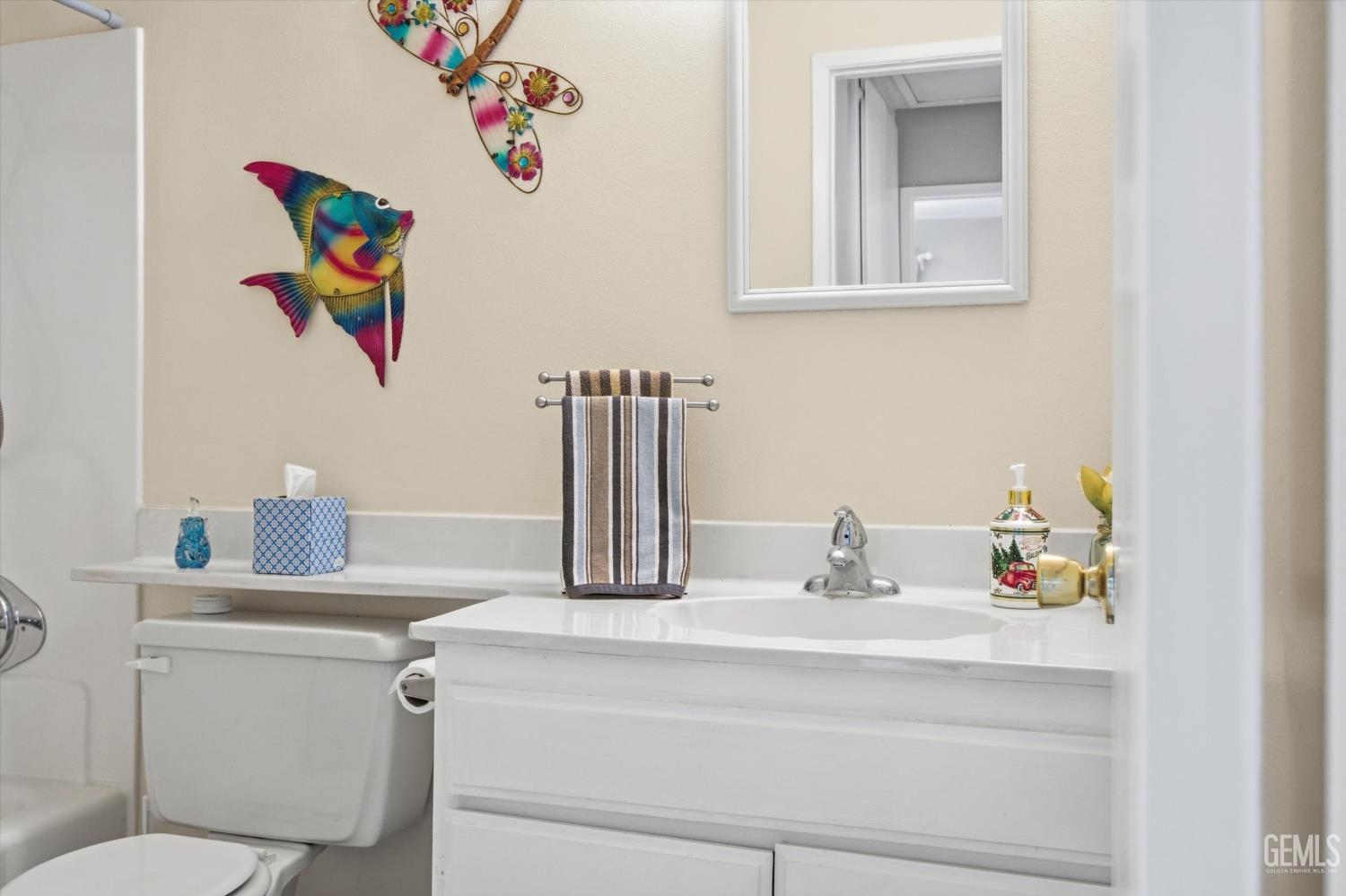 Undisclosed Address Tehachapi, CA 93561 - Photo 40 of 48 a bathroom with a sink a toilet and a mirror