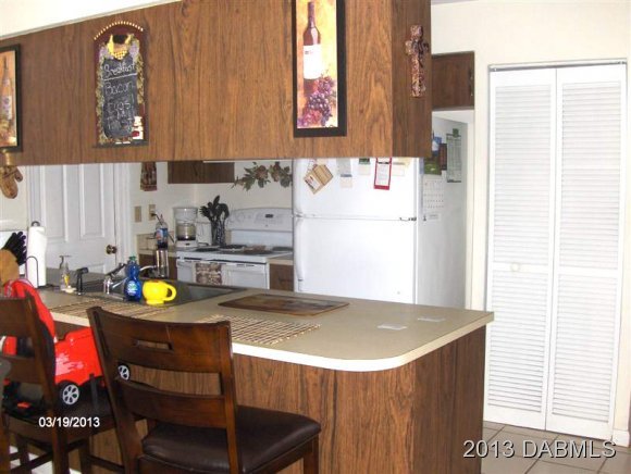 5494 Riverside Drive Port Orange, FL 32127 - Photo 2 of 13 a bathroom with a sink and a window