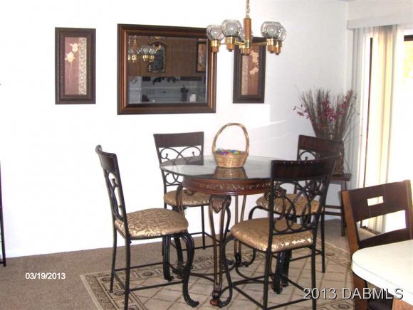 5494 Riverside Drive Port Orange, FL 32127 - Photo 6 of 13 a view of a dining room with furniture and window