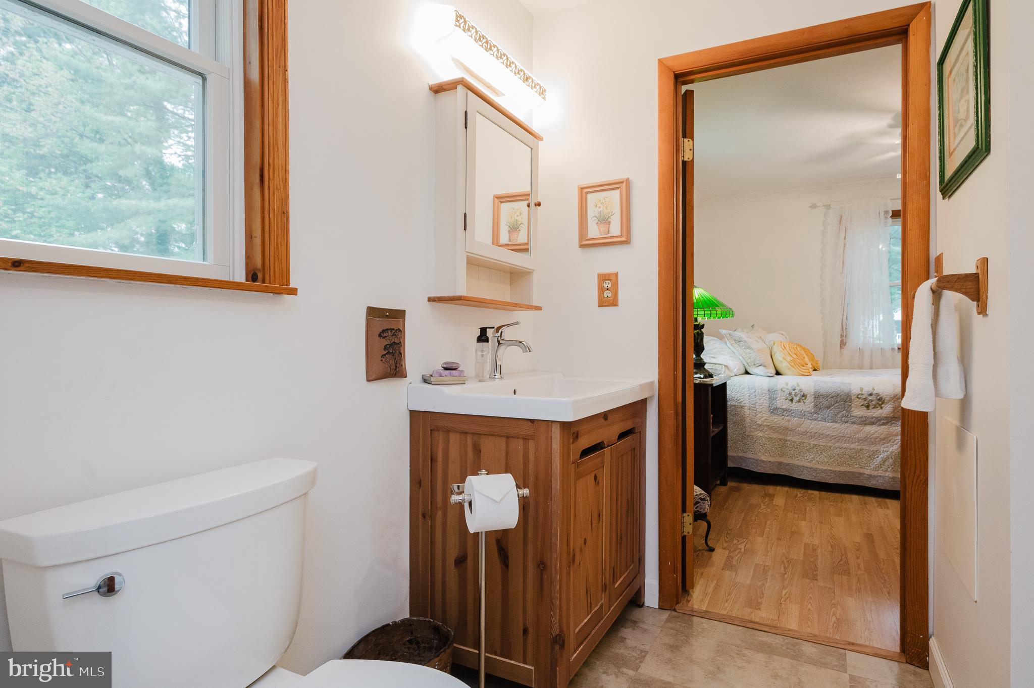 710 Magnolia Road Joppa, MD 21085 - Photo 13 of 58 a bathroom with a sink toilet and mirror