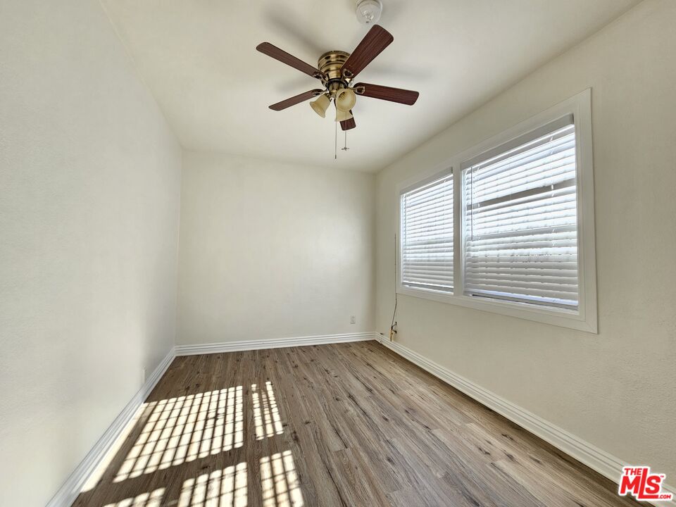 204 North Spring Avenue Compton, CA 90221 - Photo 10 of 14 wooden floor in an empty room with a window