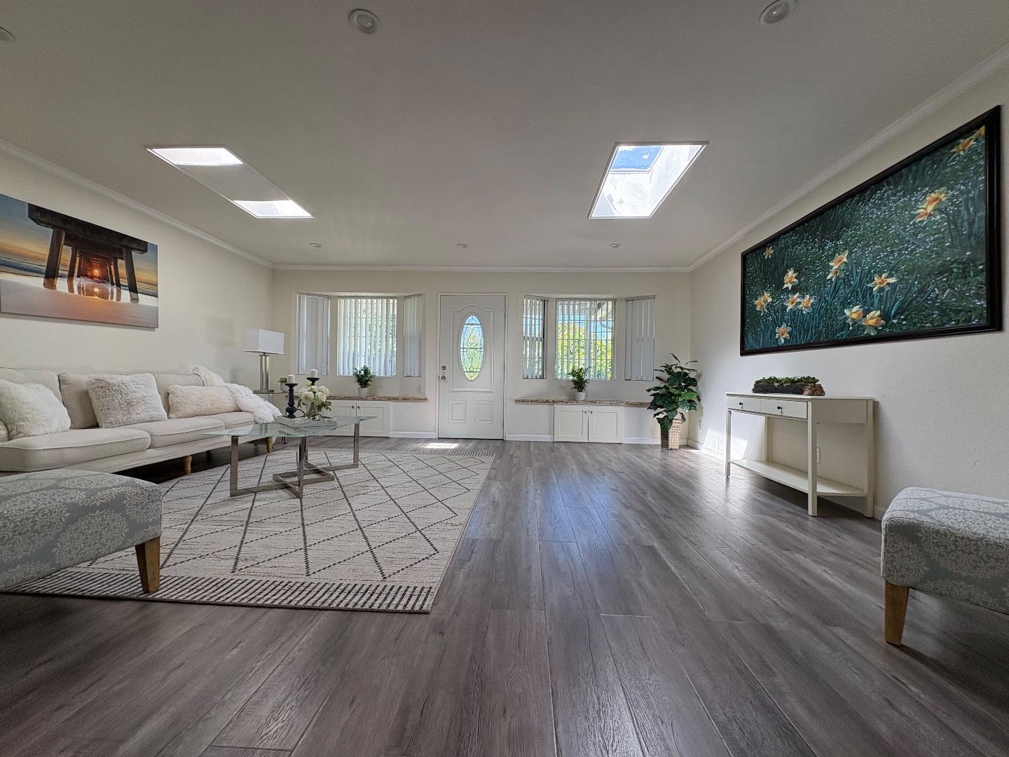 5187 Doyle Road San Jose, CA 95129 - Photo 10 of 39 a living room with furniture and a flat screen tv