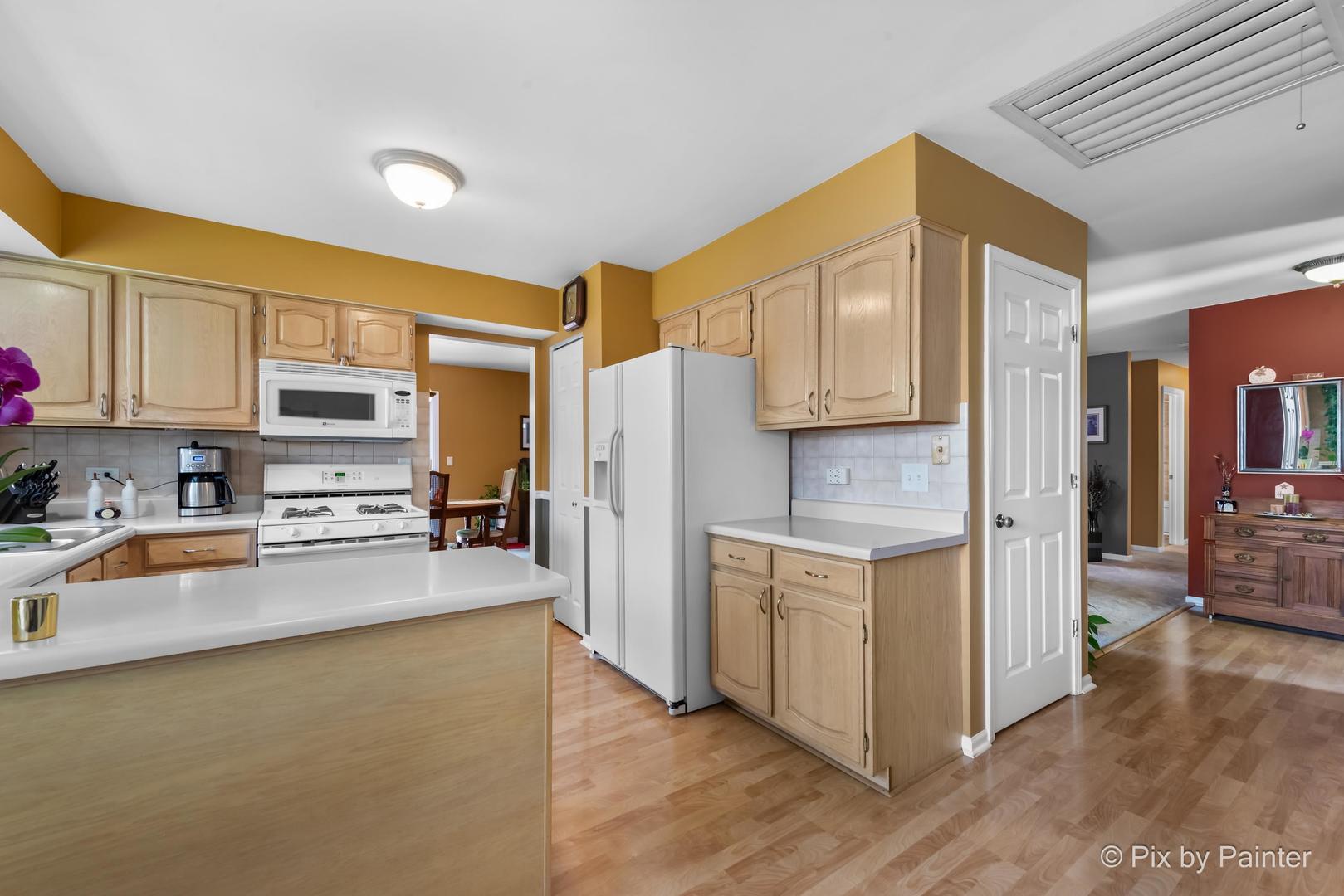 336 Claire Lane Cary, IL 60013 - Photo 20 of 29 a kitchen with stainless steel appliances a refrigerator and a stove top oven