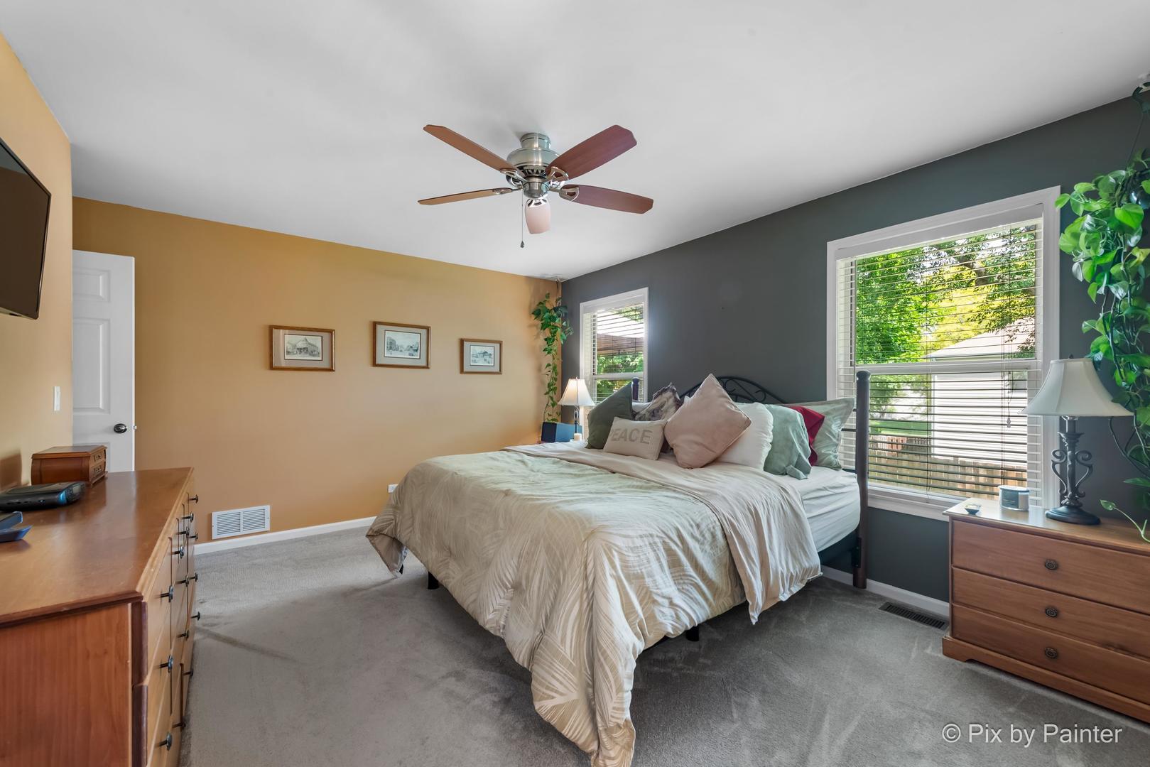336 Claire Lane Cary, IL 60013 - Photo 24 of 29 a bedroom with a bed dresser and a window