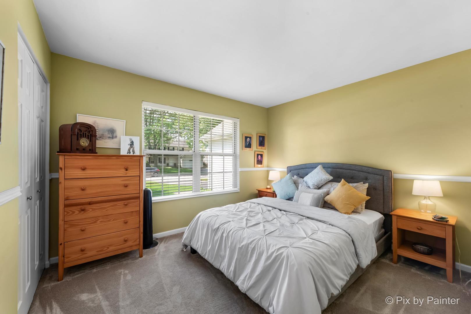 336 Claire Lane Cary, IL 60013 - Photo 27 of 29 a bedroom with a bed and a dresser