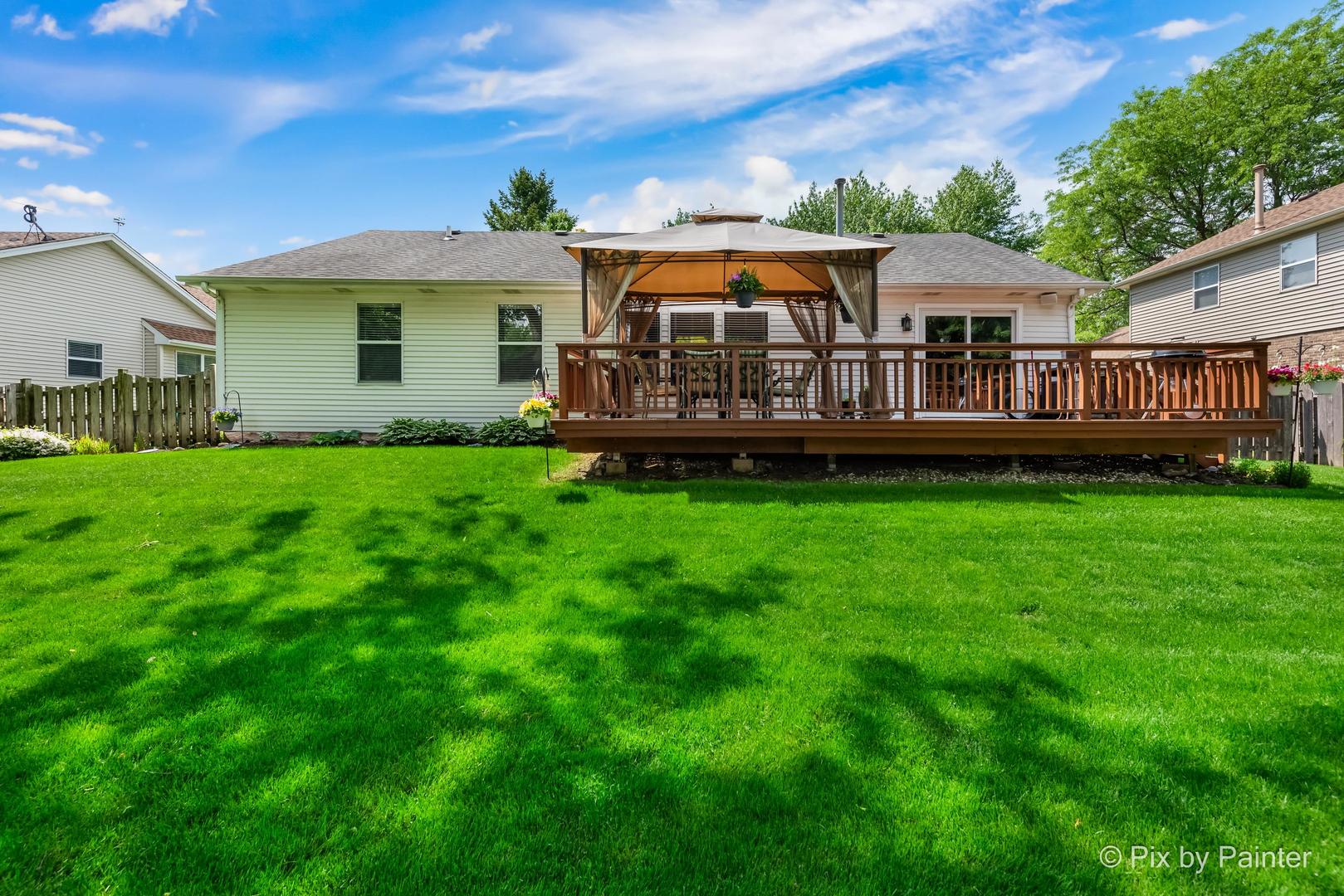 336 Claire Lane Cary, IL 60013 - Photo 5 of 29 a view of house with a big yard and potted plants