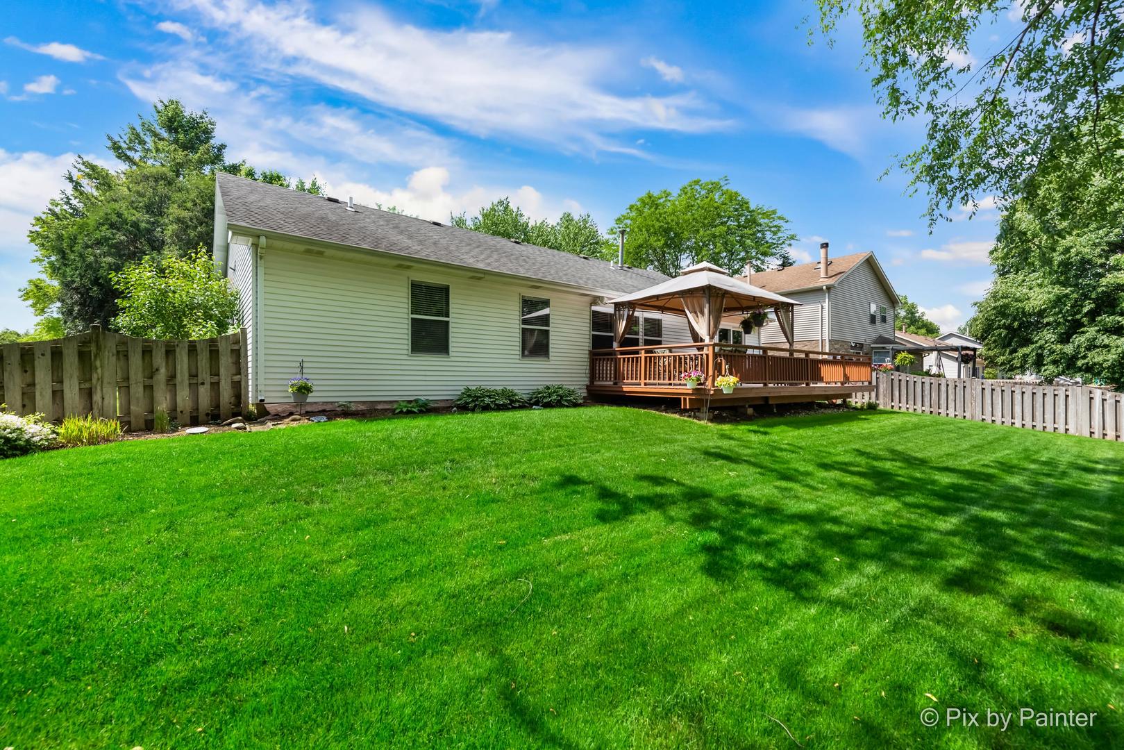 336 Claire Lane Cary, IL 60013 - Photo 6 of 29 a front view of a house with garden