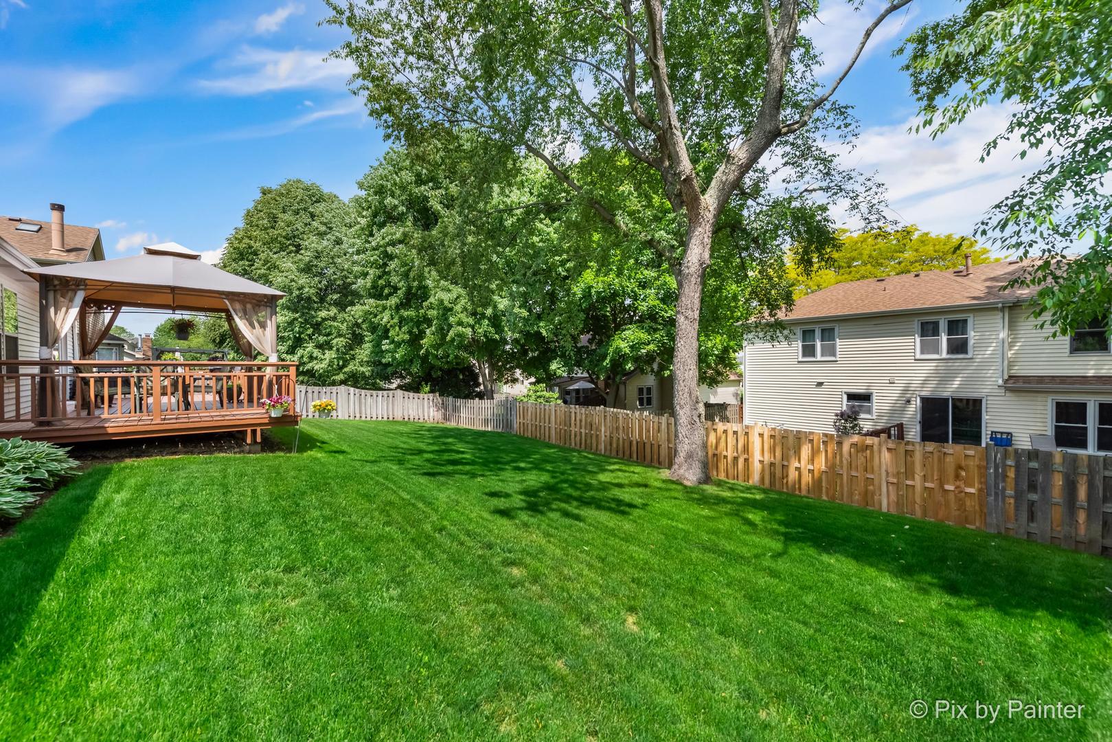 336 Claire Lane Cary, IL 60013 - Photo 7 of 29 a view of a house with backyard and a tree