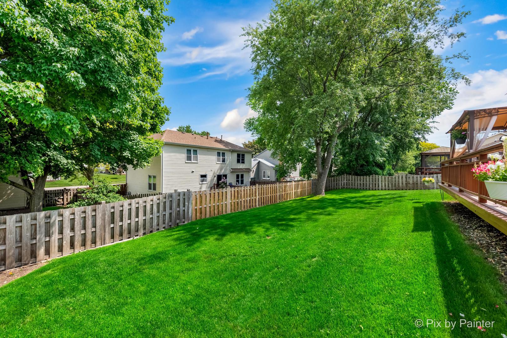 336 Claire Lane Cary, IL 60013 - Photo 8 of 29 a view of a house with backyard and a tree