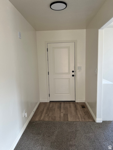 1696 South Longview Road Santaquin, UT 84655 - Photo 4 of 16 Doorway featuring carpet floors and baseboards