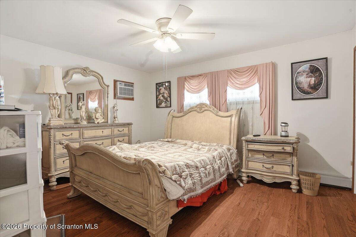 101 Stone Street Moosic, PA 18507 - Photo 19 of 53 a bedroom with a bed and a chandelier