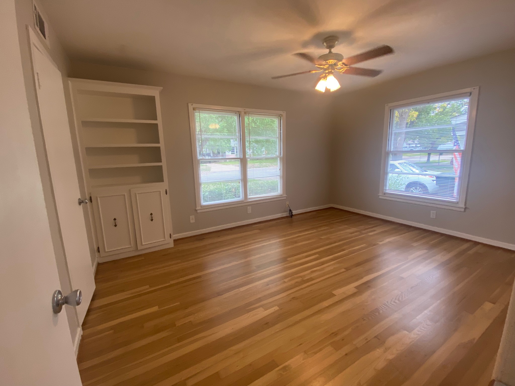 1818 South 39th Street Temple, TX 76504 - Photo 8 of 14 Bedroom with wood finished floors, built in features, and ceiling fan