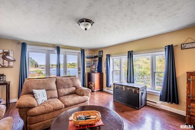 an aerial view of residential house with outdoor space and lake view