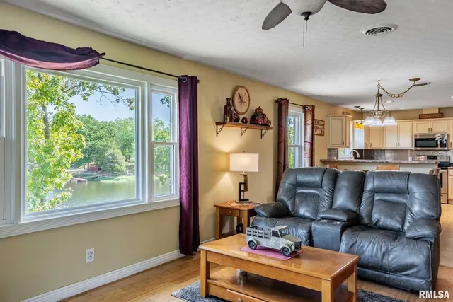 a work room with furniture and flat screen tv