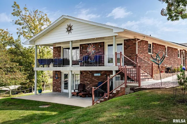 an aerial view of a houses with a lake view