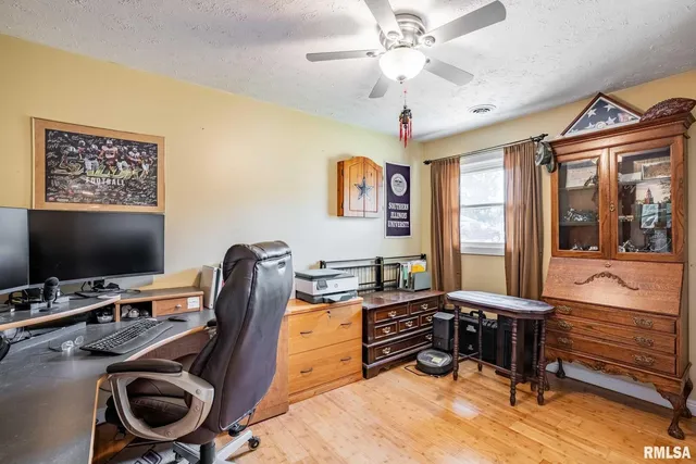 a living room with furniture and stairs
