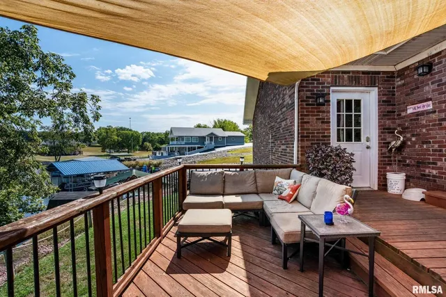 a front view of a house with outdoor seating