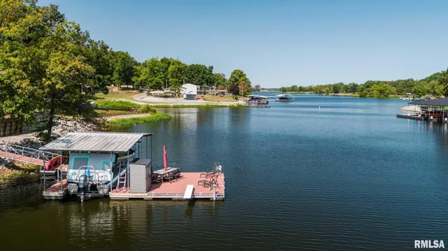 a view of a lake with wooden floor and city view
