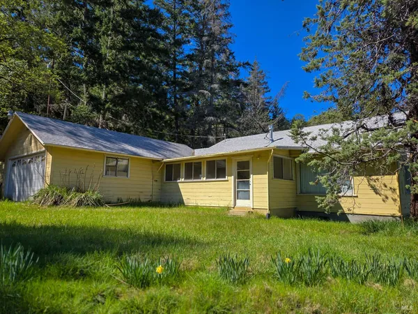 a view of a house with a yard
