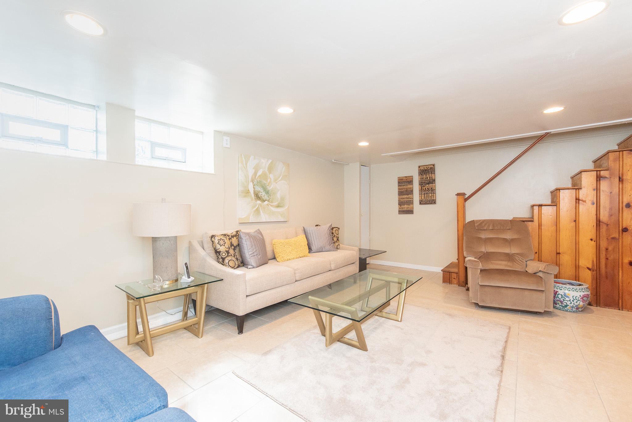 1520 Winford Road Baltimore, MD 21239 - Photo 22 of 30 a living room with furniture and a lamp
