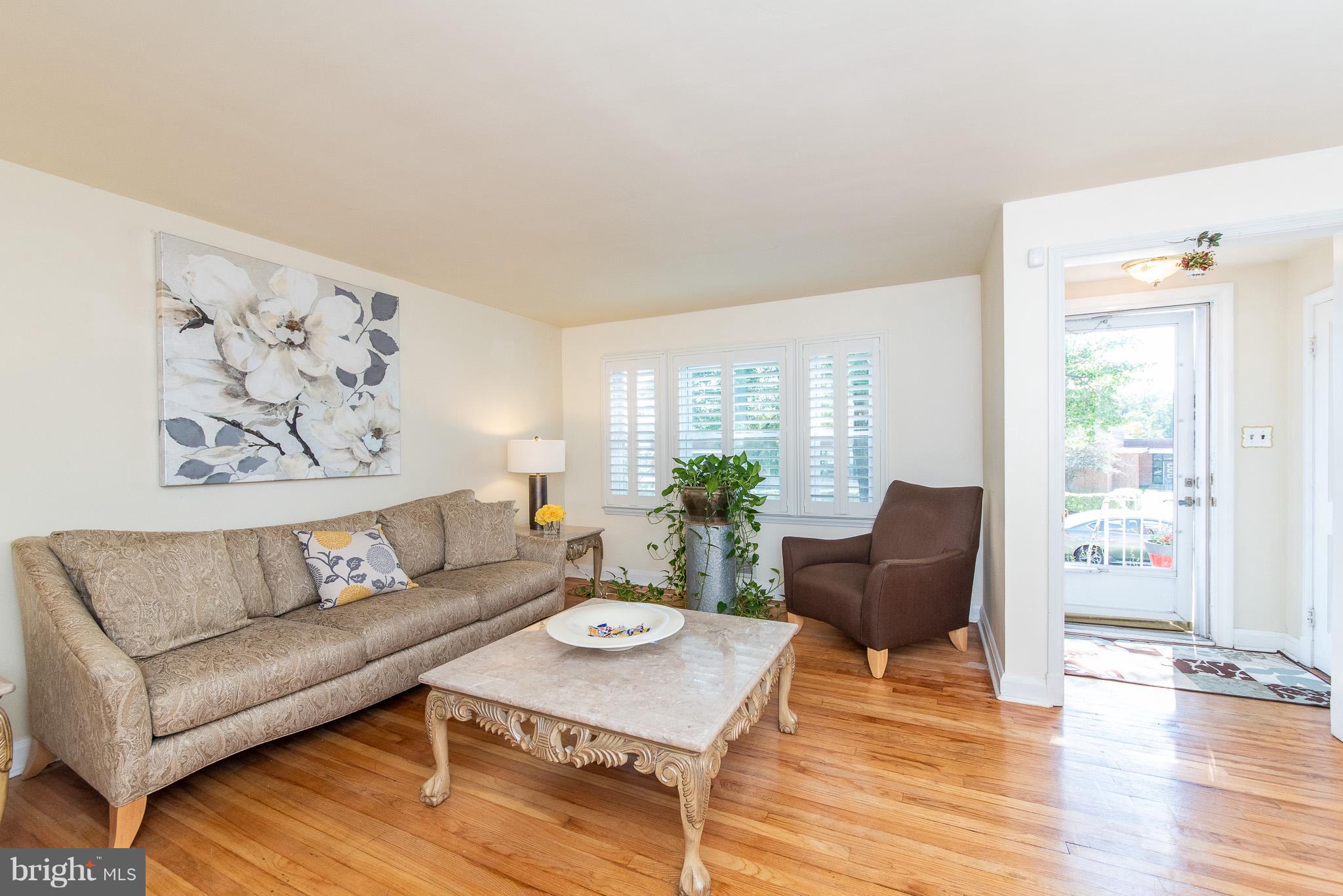 1520 Winford Road Baltimore, MD 21239 - Photo 4 of 30 a living room with furniture and wooden floor