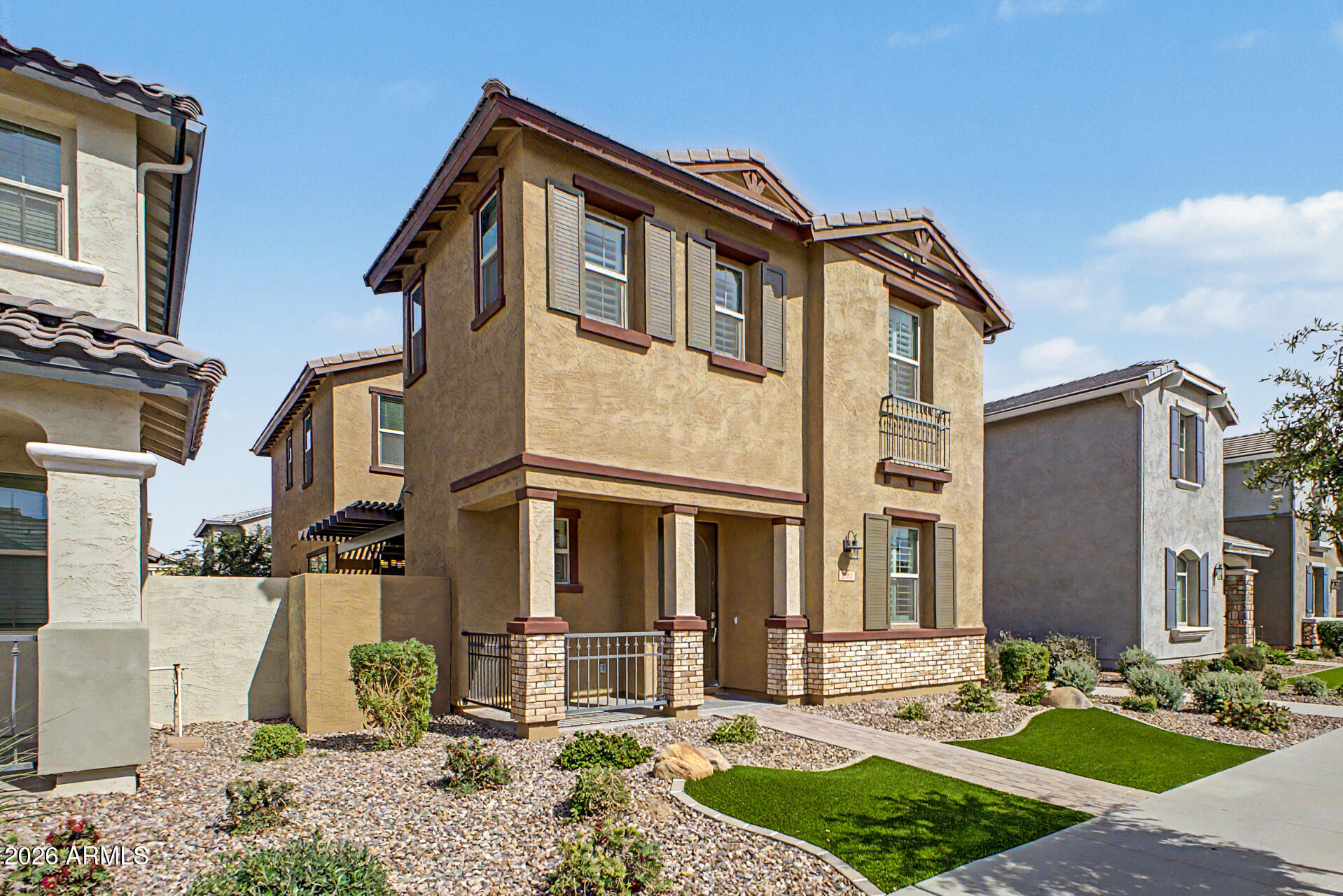 2583 South Entwistle Street Gilbert, AZ 85295 - Photo 1 of 42 a front view of a house with garden and plants