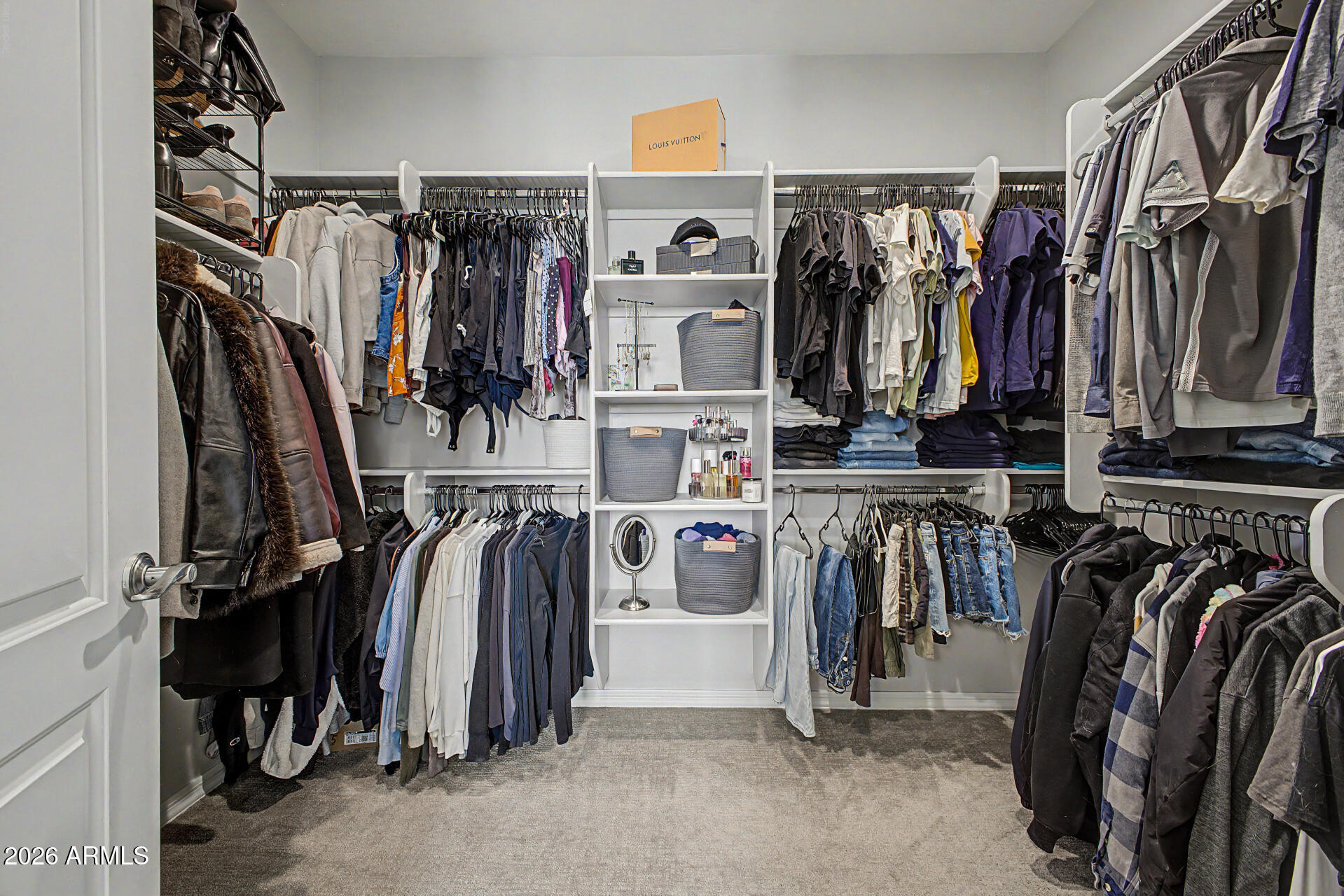 2583 South Entwistle Street Gilbert, AZ 85295 - Photo 18 of 42 a view of walk in closet with clothes and shoes