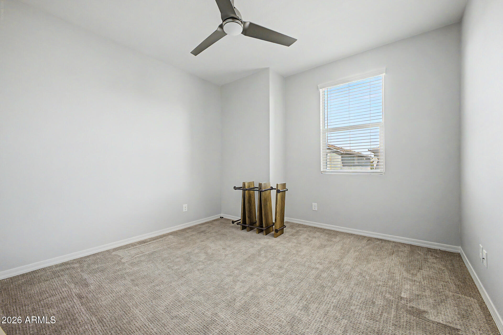 2583 South Entwistle Street Gilbert, AZ 85295 - Photo 19 of 42 an empty room with windows & cabinet