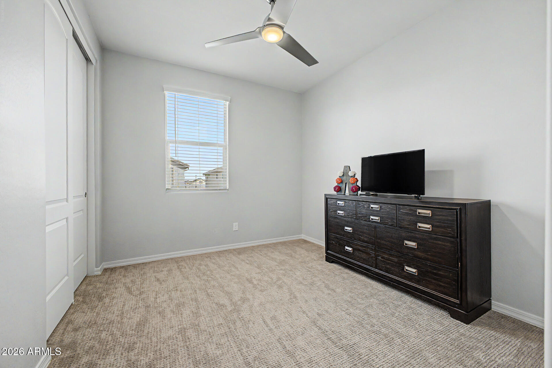 2583 South Entwistle Street Gilbert, AZ 85295 - Photo 21 of 42 a room with furniture and flat screen tv