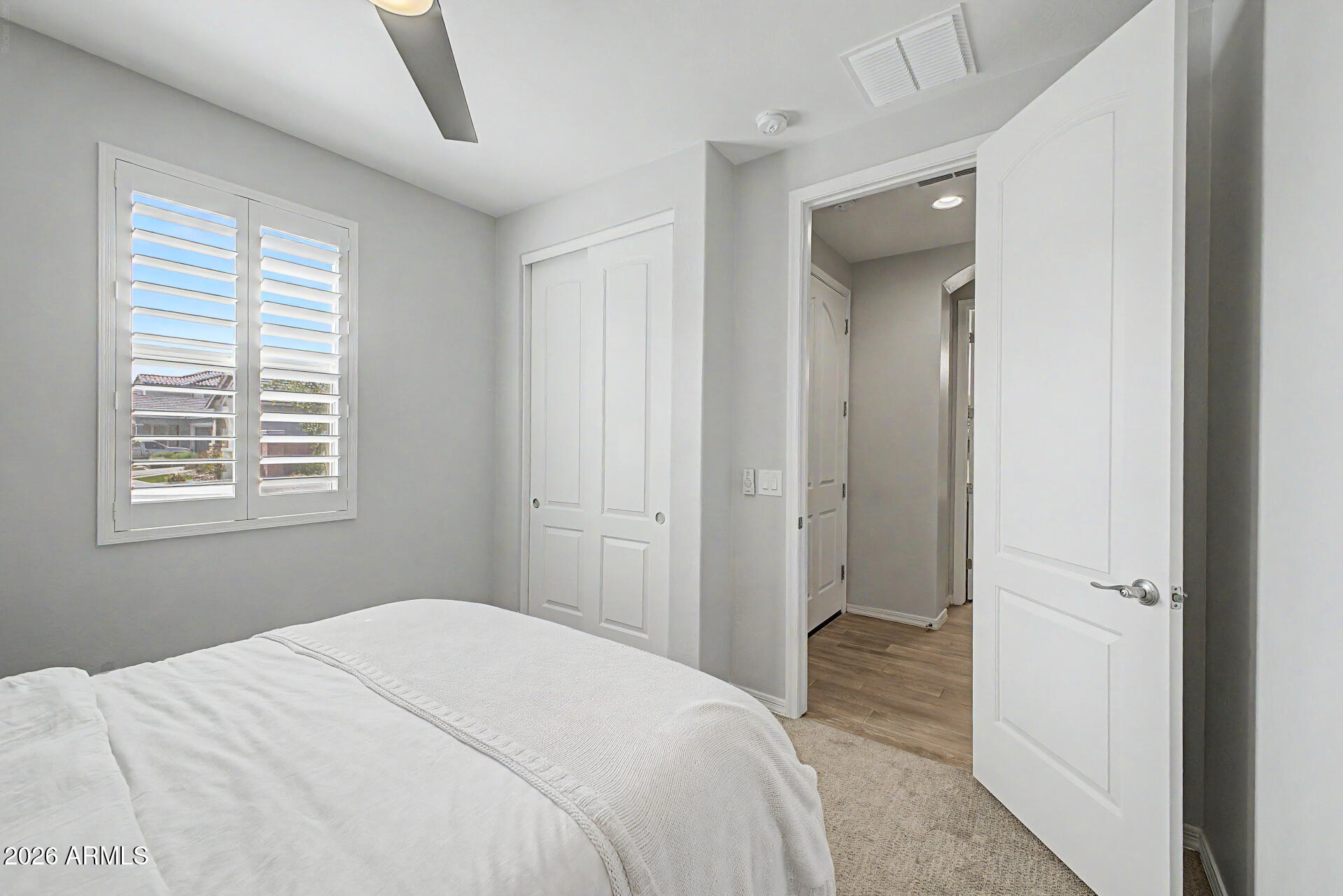 2583 South Entwistle Street Gilbert, AZ 85295 - Photo 28 of 42 a bedroom with a bed and a window