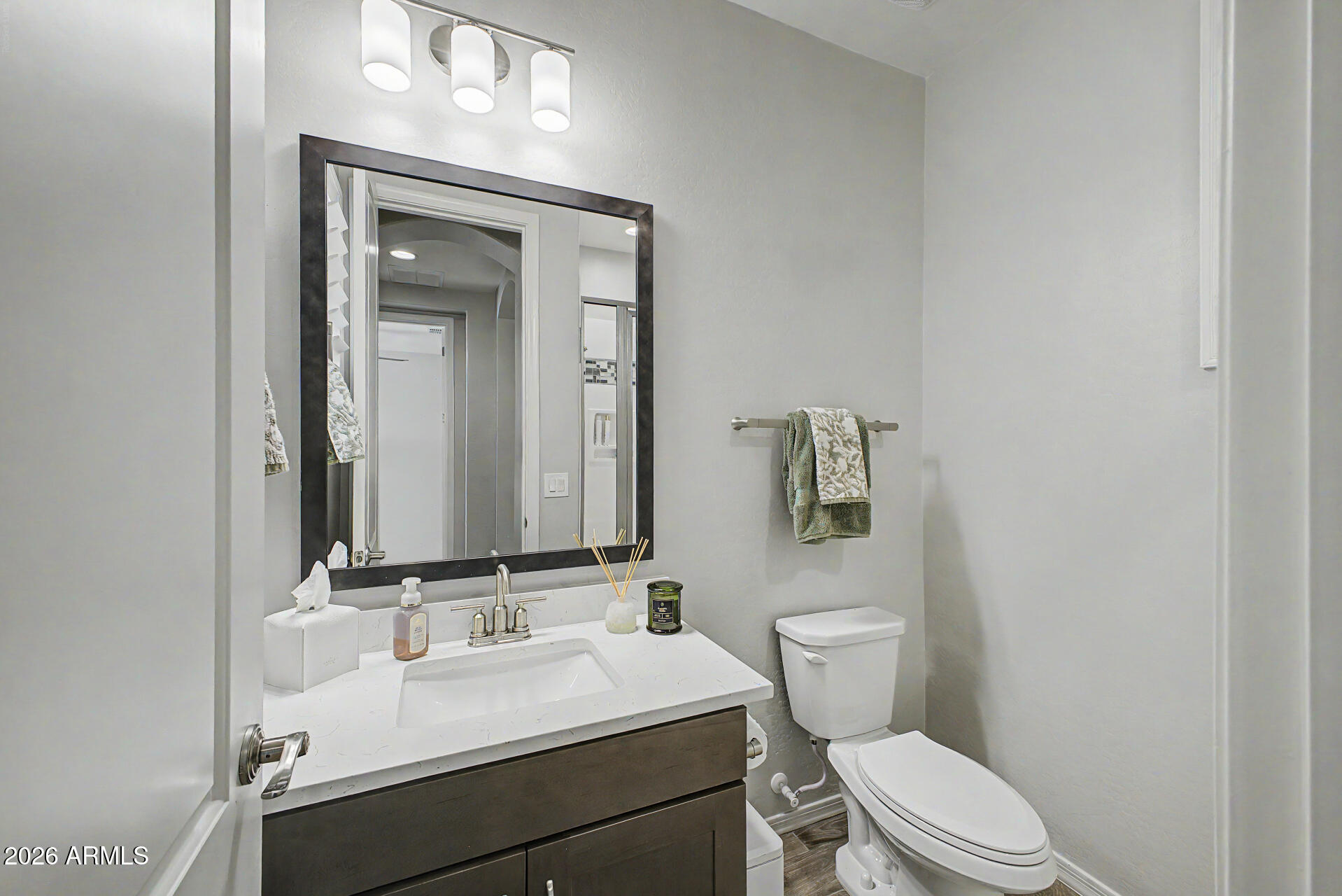 2583 South Entwistle Street Gilbert, AZ 85295 - Photo 29 of 42 a bathroom with a sink vanity mirror and toilet