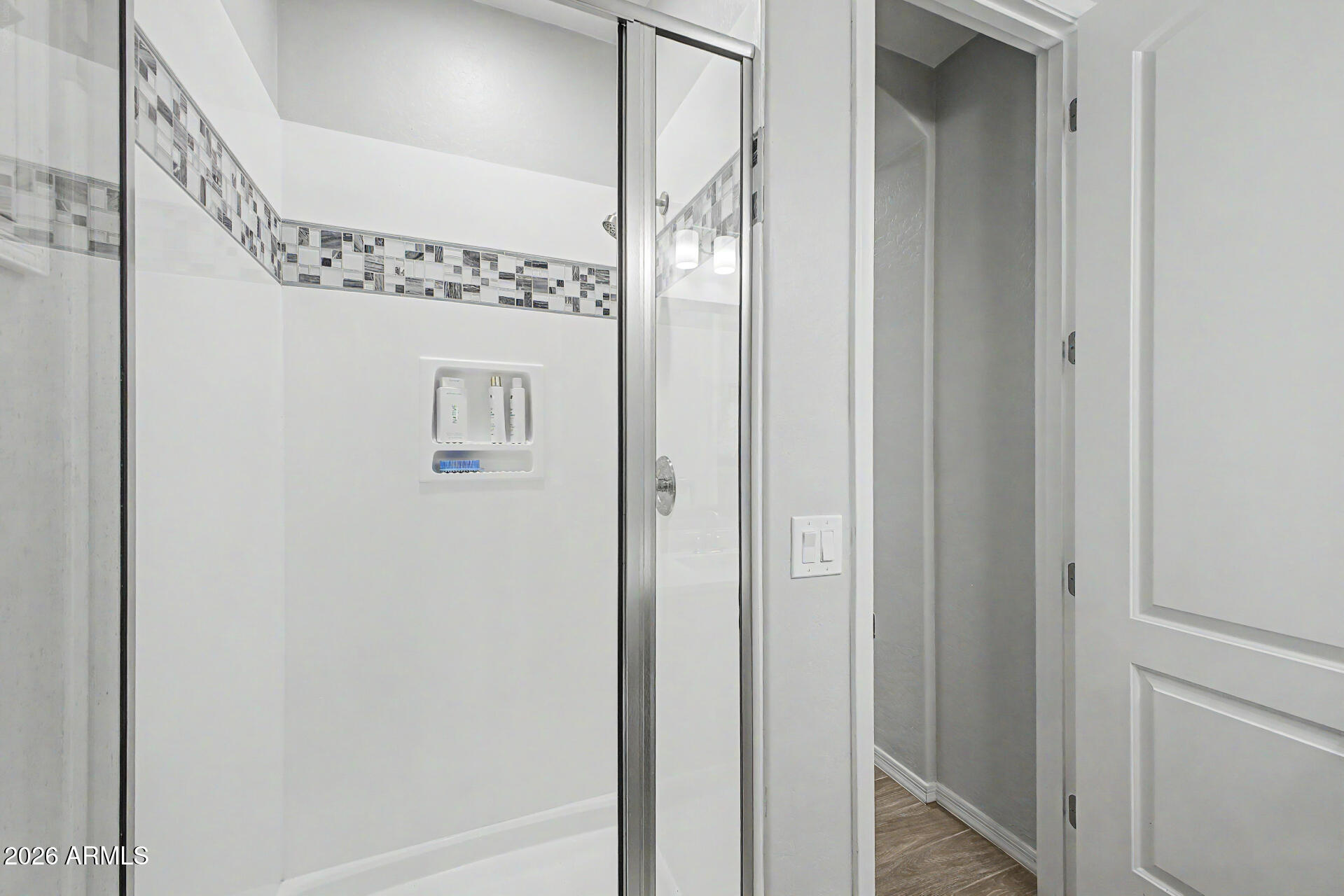 2583 South Entwistle Street Gilbert, AZ 85295 - Photo 30 of 42 a bathroom with a glass shower door and a sink