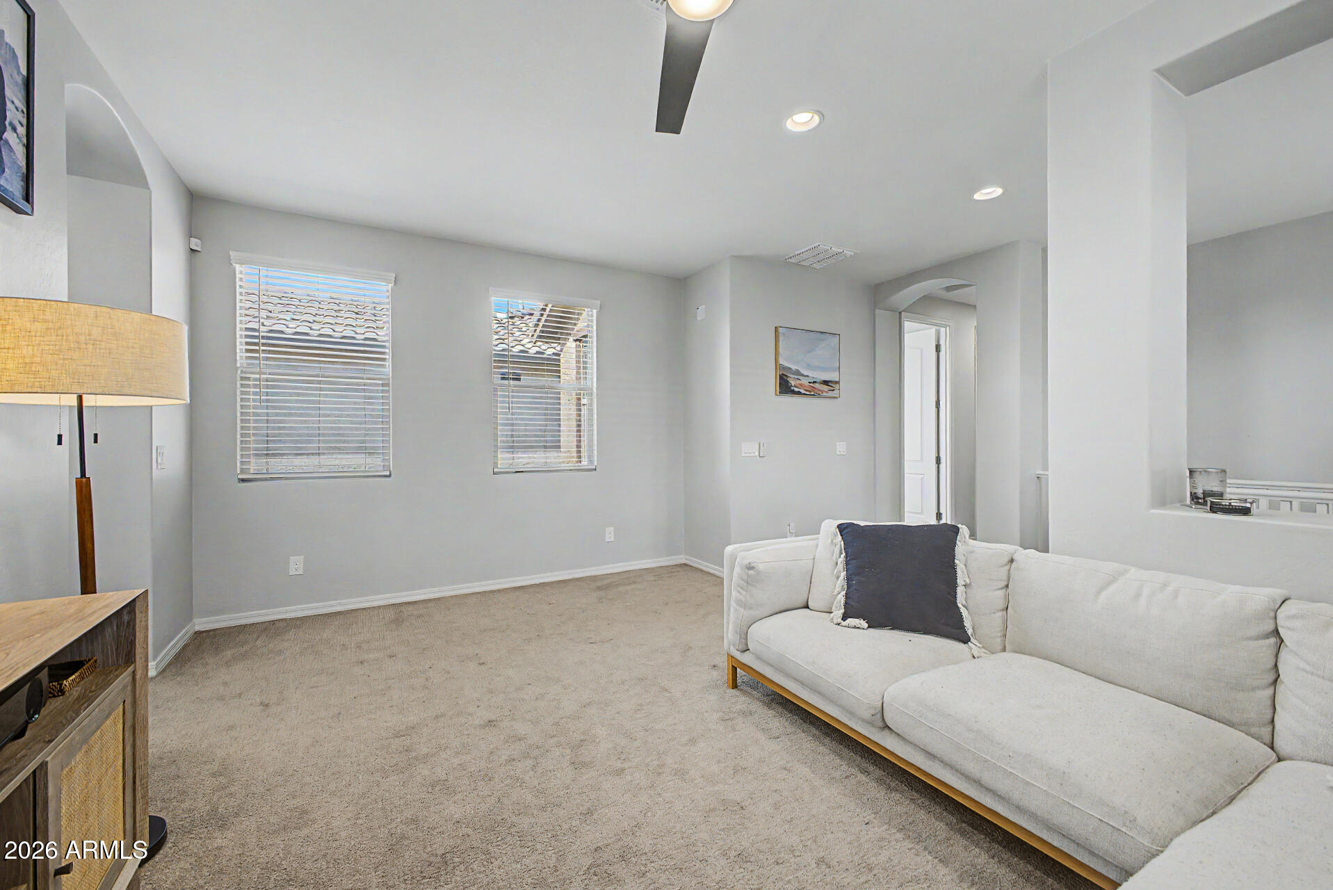 2583 South Entwistle Street Gilbert, AZ 85295 - Photo 32 of 42 a living room with furniture and a flat screen tv