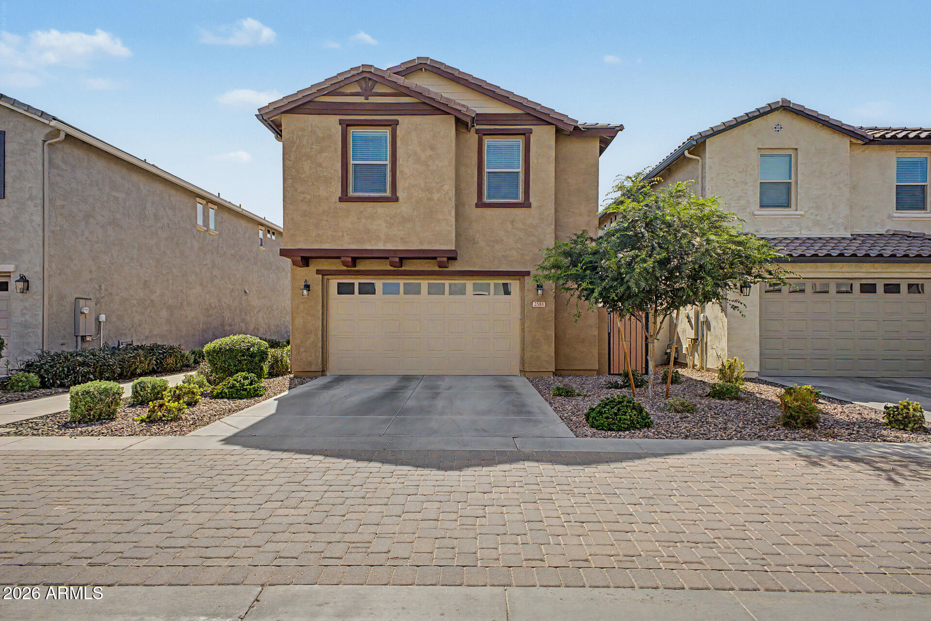 2583 South Entwistle Street Gilbert, AZ 85295 - Photo 37 of 42 a front view of a house with garden