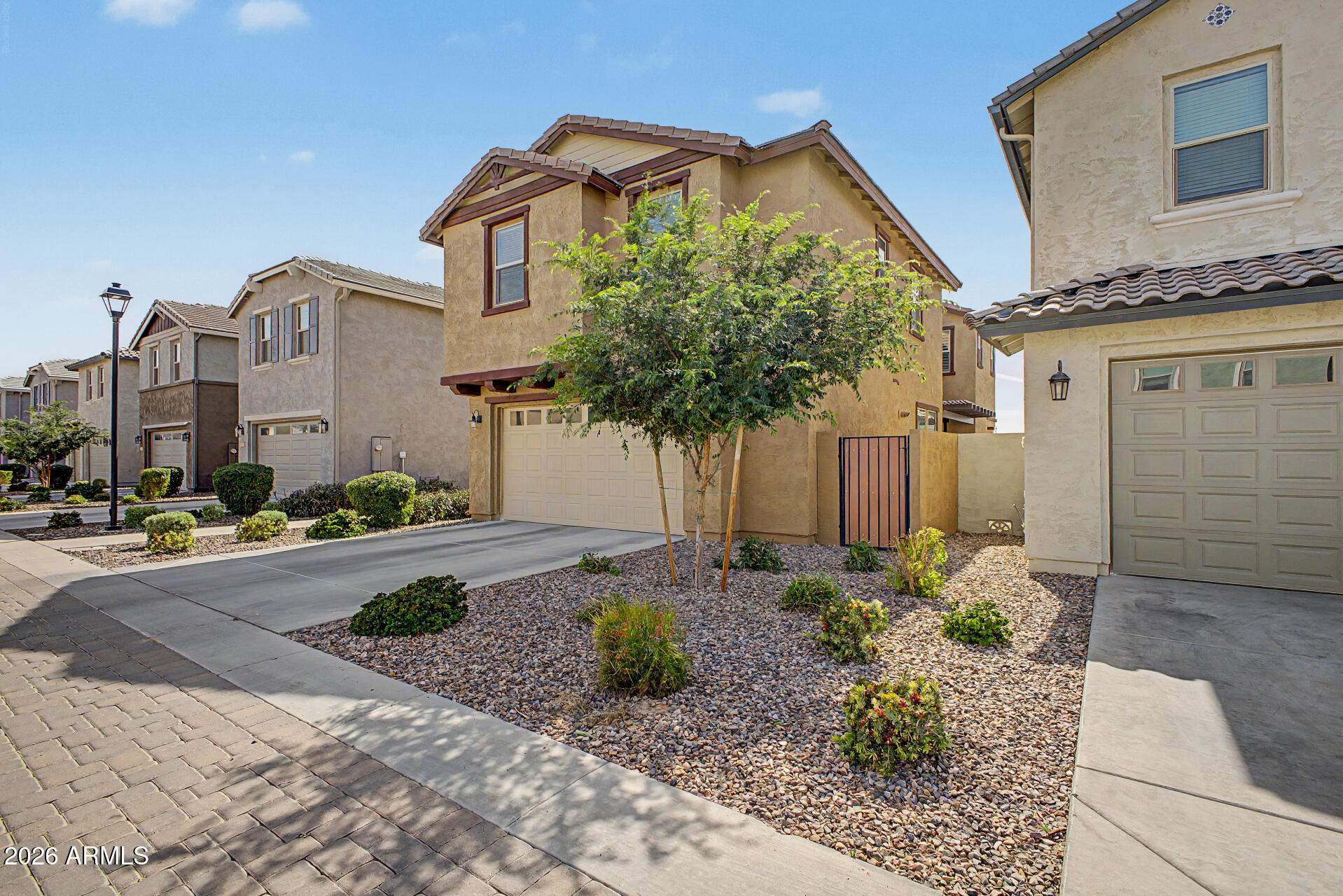2583 South Entwistle Street Gilbert, AZ 85295 - Photo 39 of 42 a front view of a house with garden