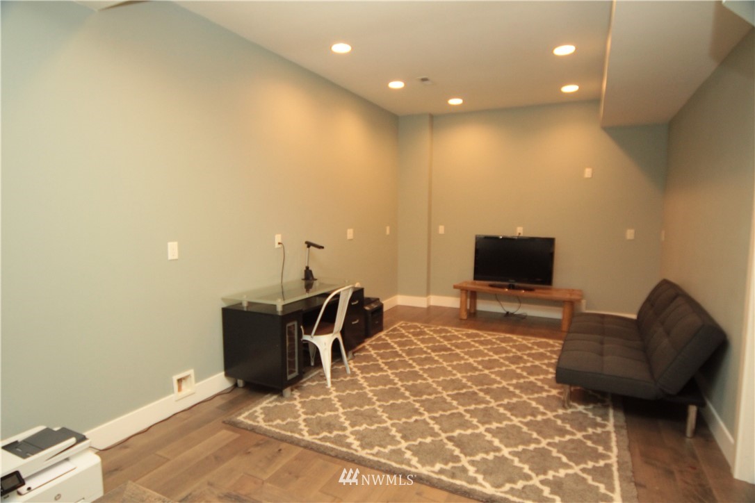 205 West Wiser Lake Road Ferndale, WA 98248 - Photo 22 of 24 a living room with furniture and a flat screen tv