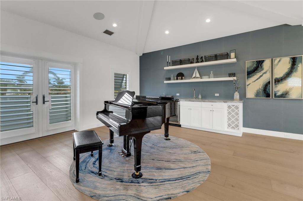 1300 Cobia Court Naples, FL 34102 - Photo 18 of 41 a living room with furniture and a wooden floor