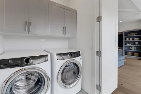 a view of storage and utility room with washer and dryer