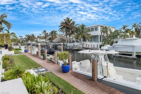a view of a swimming pool with a patio and a garden