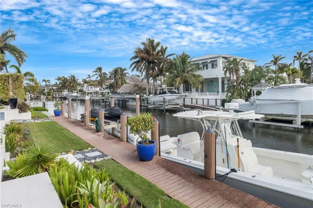 a view of a swimming pool with a patio and a garden