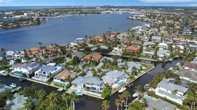 an aerial view of a city with ocean view